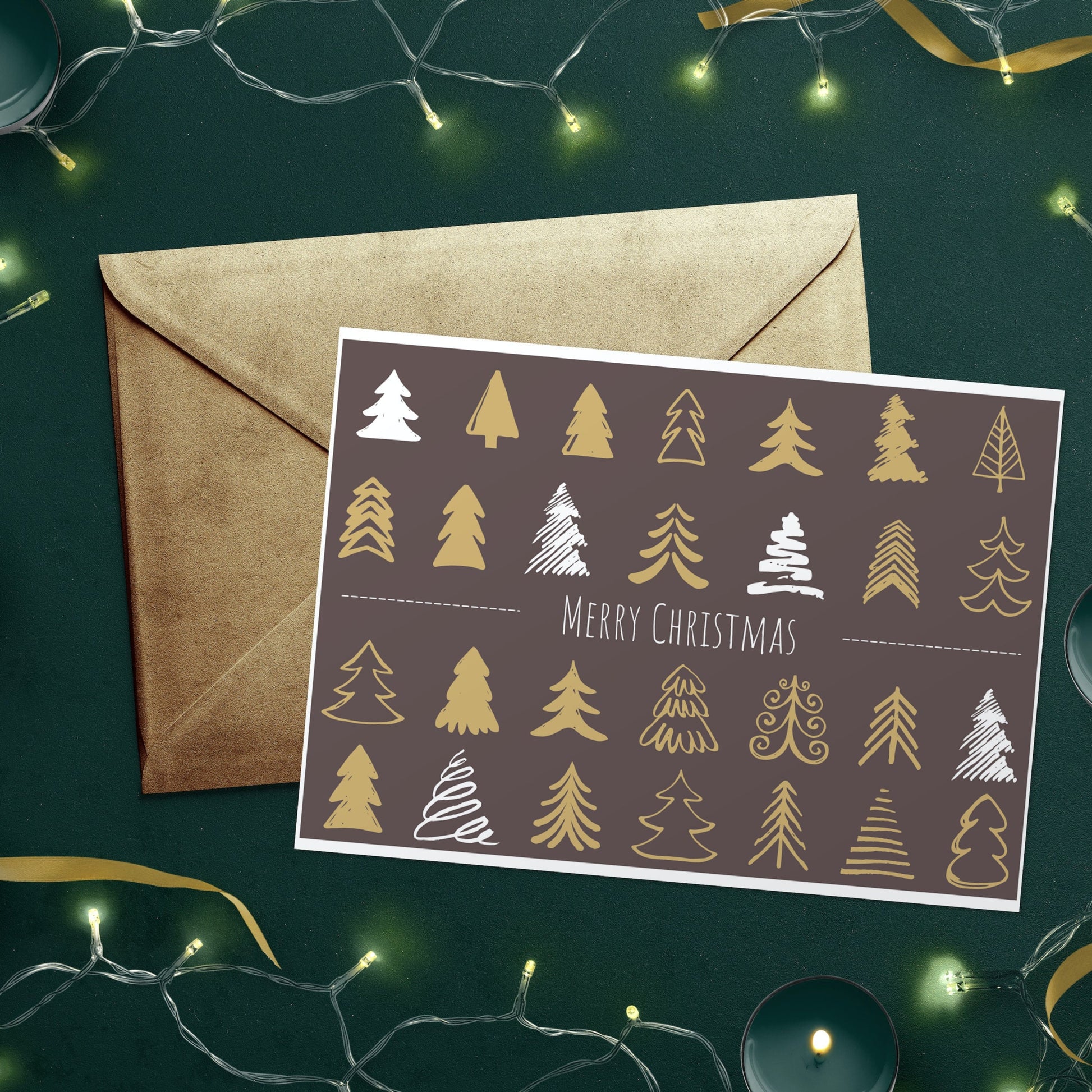 A Christmas card with a decorative tree pattern, displayed with an envelope, against a green background with Christmas lights.